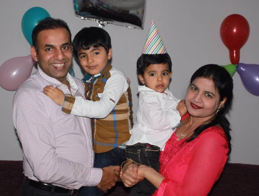 Pramod Agarwal with his wife and two children at a party